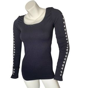 Seams Lovely black stretch long sleeve cutout top